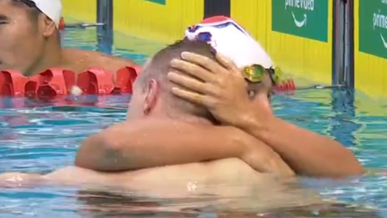 Fellow swimmers console Matt Wilson. Photo: Amazon Prime