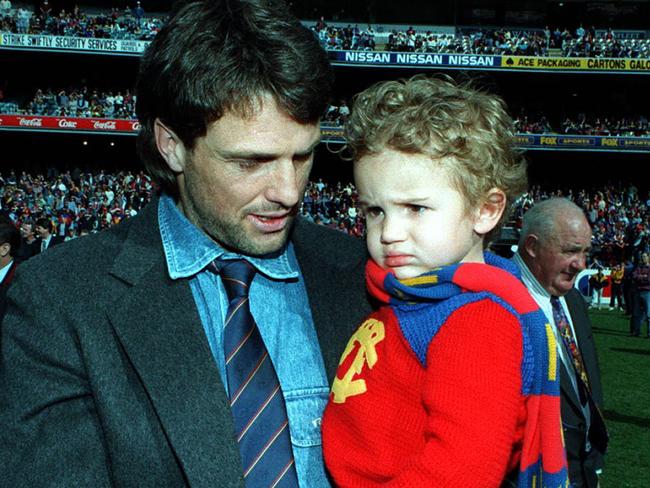 Sydney swans player & former Lion, Paul Roos & son at AFL match Richmond v Fitzroy, it was Lions last game in Victoria as they are merging with Brisbane Bears for 1997 season.  Australian Rules 1996Roos/Fam