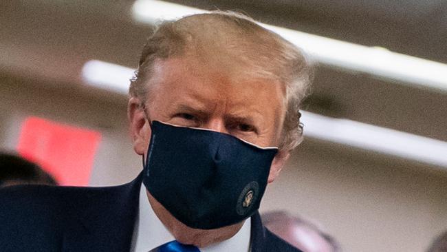 US President Donald Trump wears a mask as he visits Walter Reed National Military Medical Center in Bethesda, Maryland. Picture: AFP