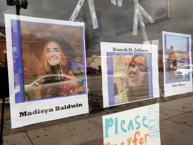 Pictures in the window of a downtown business honour students killed in the November 30 shooting at Oxford High School. Picture: Getty/AFP