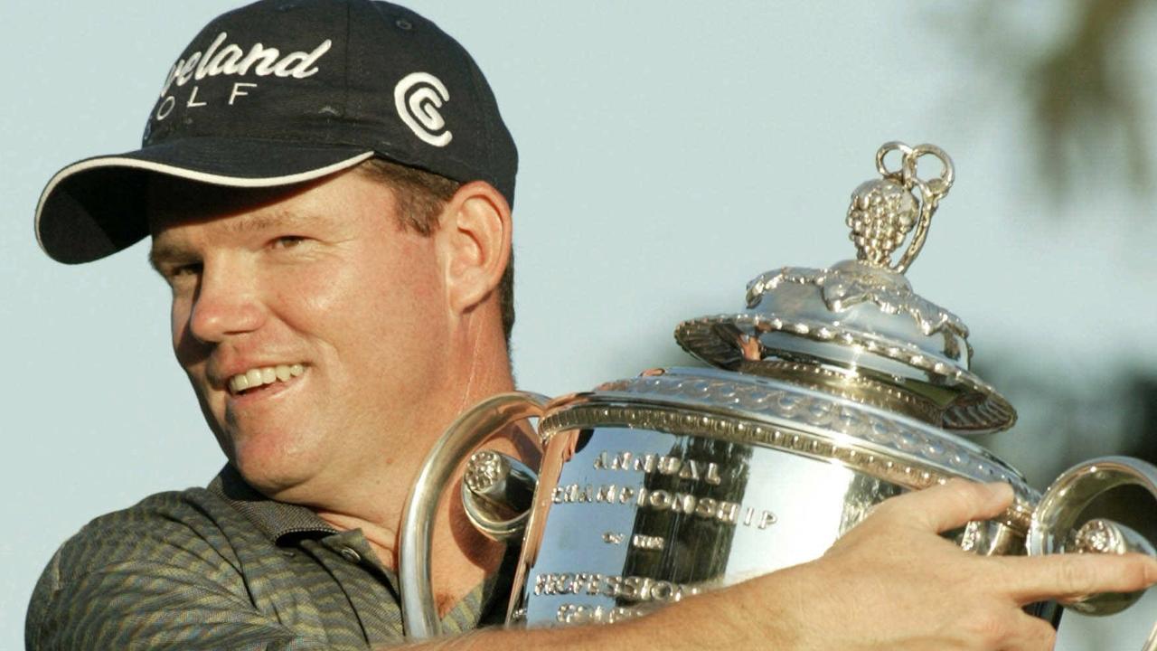 Shaun Micheel embraces his trophy after winning the 85th PGA Championship, at the Oak Hill Country Club outside Rochester, New York, 17/08/03. Golf P/L