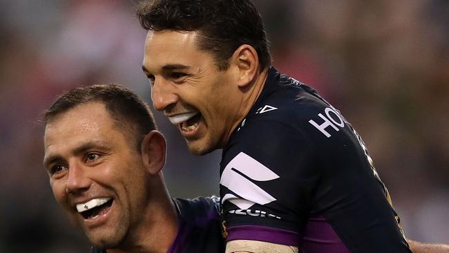 Cameron Smith and Billy Slater of the Storm celebrate Slater scoring a try against the Dragons last year. Photo: Getty Images