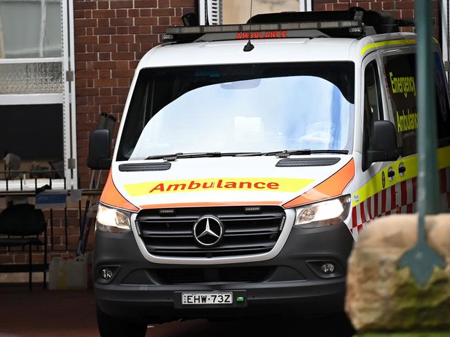 SYDNEY, AUSTRALIA -TelegraphMarch 21, 2022: An ambulance leaves the RPA Hospital as paramedics begin industrial action . Picture:  Jeremy Piper