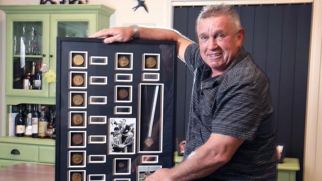 Port Adelaide champion Greg Phillips with his impressive collection of Port Adelaide SANFL premiership medals. Picture: Dean Martin