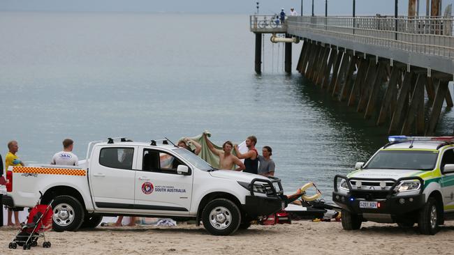 Police, paramedics and surf lifesavers at Glenelg beach after a teenager drowned. Picture: AAP / Ben Macmahon