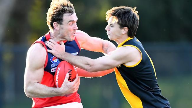 SFNL: Chelsea Heights’ Luke Tapscott tries to fend off Rex Kilburn of Cheltenham. Picture: Josh Chadwick