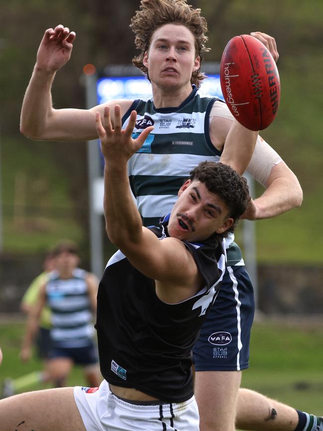 VAFA: Will Stephenson of Old Geelong and Mazenod’s Andrew Kovac fly for the ball. Photo: Hamish Blair