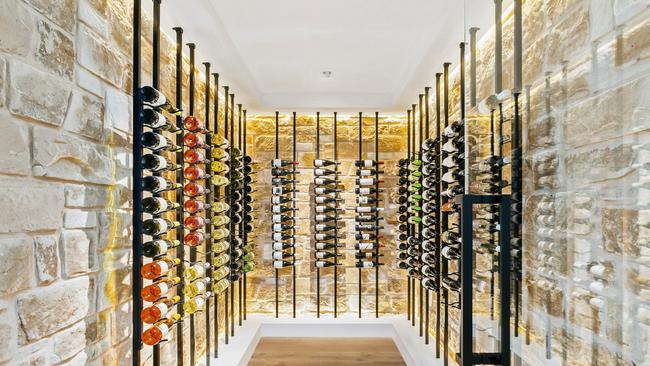 The stunning wine room with feature lighting.