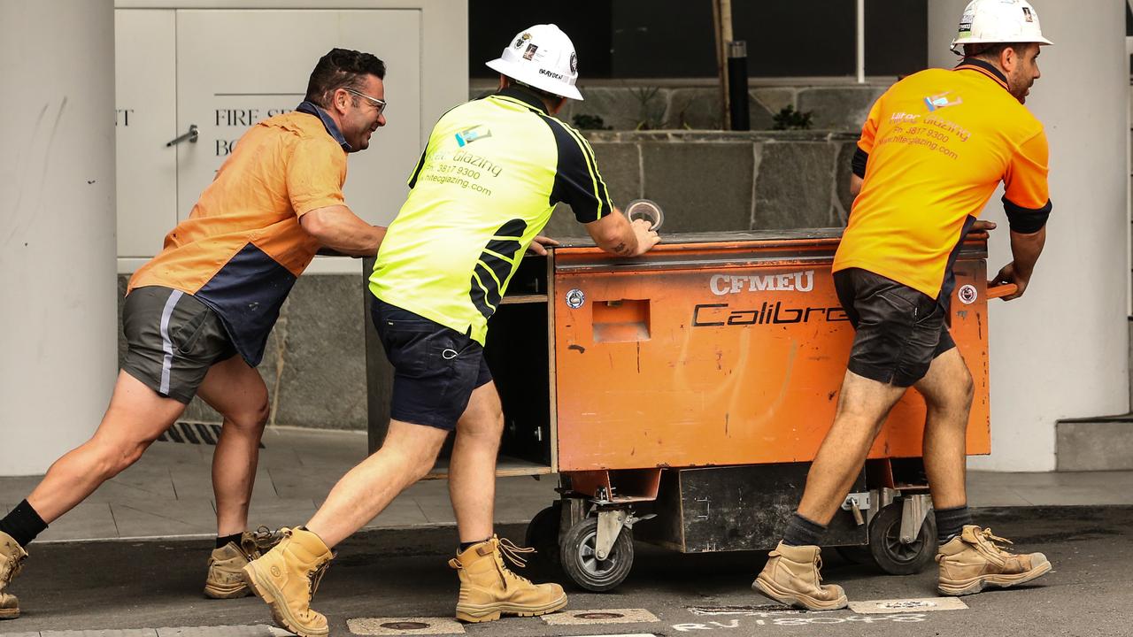 Workers leave the Probuild worksite on 443 Queens Street in Brisbane last month. Picture: Zak Simmonds