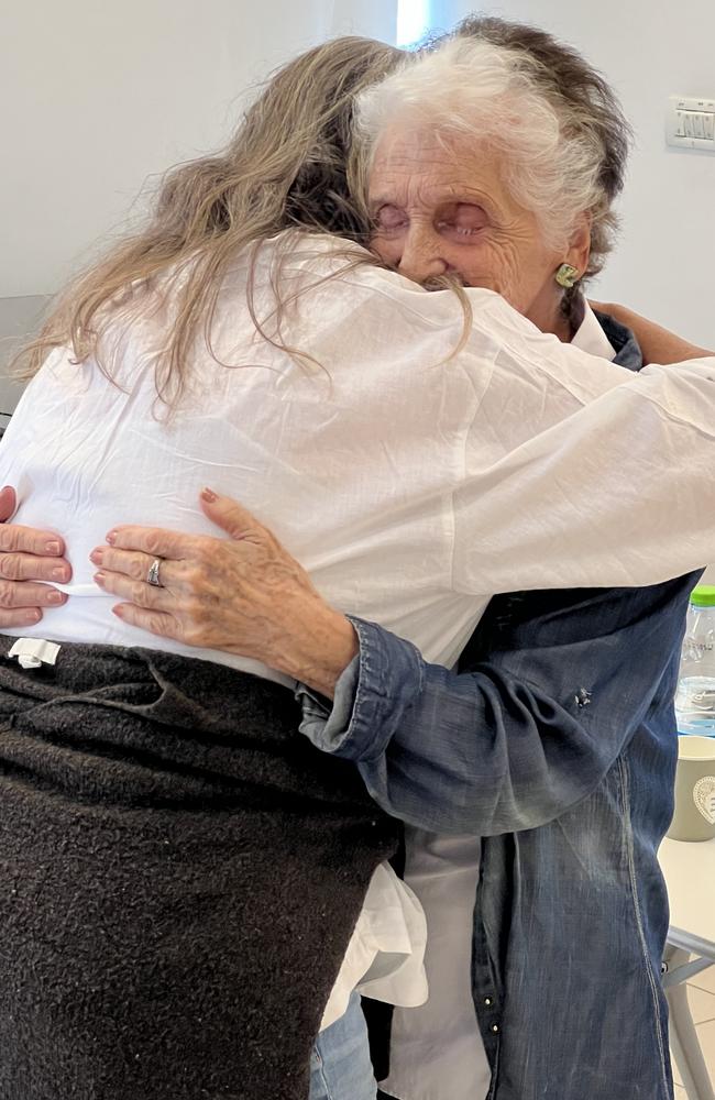 Berthe Badehi is hugged by Sunshine Coast woman Renee White after her moving story at the Yad Vashem Holocaust Museum in Jerusalem. Photo: Mark Furler