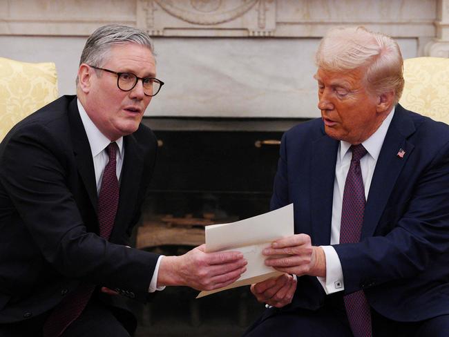 US President Donald Trump holds a letter from Britain's King Charles III during a meeting with British Prime Minister Keir Starmer in the Oval Office of the White House. Picture: AFP