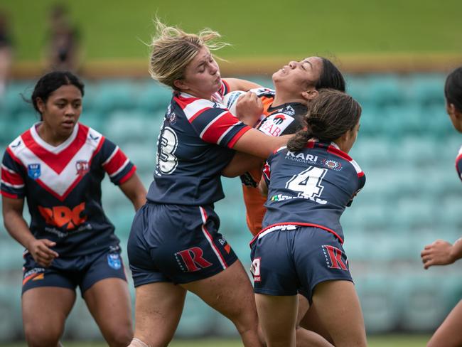 Lacey Cross (left) makes a big tackle. Picture: Julian Andrews