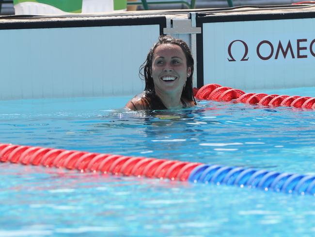 Chloe Esposito of Australia smiles during the swimming leg.