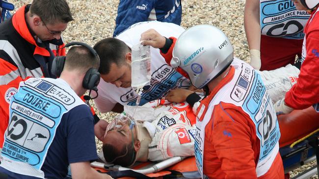 The rookie is carried away by medics at the Nuerburgring racetrack on July 21, 2007 after a serious crash in qualifying. Photo: AFP Pic