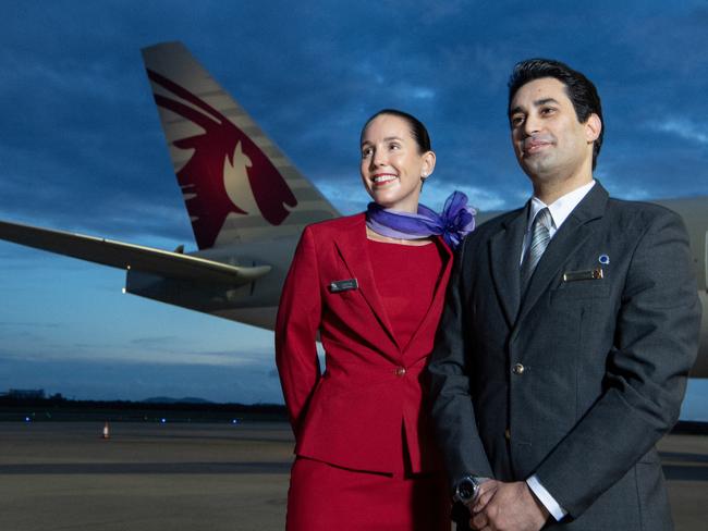 BRISBANE, AUSTRALIA - DECEMBER 04: In this image released on December 12, crew from both Virgin Australia and Qatar Airways beside a Qatar Airways Boeing 777 at Brisbane Airport on December 04, 2024 in Brisbane, Australia. A new partnership between the two airlines has been launched which will deliver more value and choice to Australians, providing opportunities to travel to over 100 destinations across Europe, the Middle East and Africa. From December 12, Aussies can book Virgin Australia's new direct services from Sydney, Brisbane and Perth to Doha for travel from June 2025, with Melbourne set to launch later in 2025. These flights will be operated by Virgin Australia using Qatar Airways' spacious Boeing 777s, renowned for their Qsuite Business Class. (Photo by James D. Morgan/Getty Images for Virgin Australia)