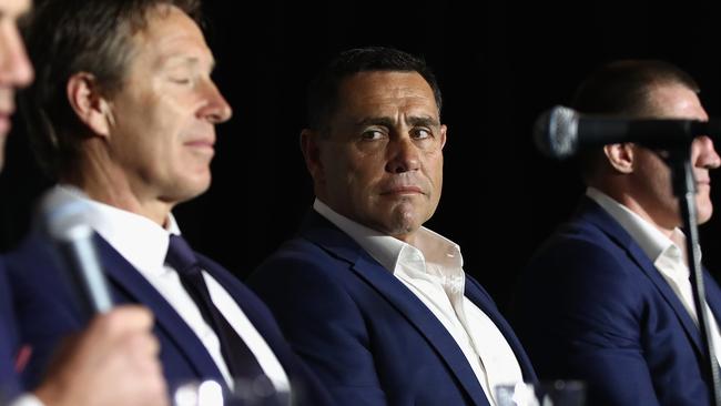 Cronulla Sharks coach Shane Flanagan looks at opponent Craig Bellamy during the grand final launch.