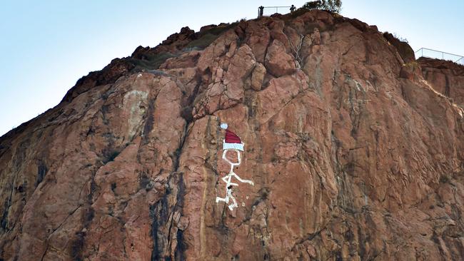 Townsville’s iconic Saint on Castle Hill has gotten into the Christmas spirit with the addition of a Santa hat. Picture: Alix Sweeney