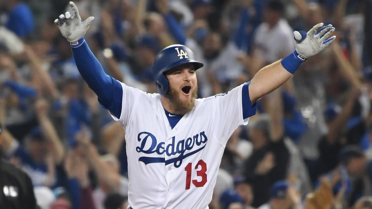 Max Muncy celebrates his 18th inning walk-off homer to defeat the Boston Red Sox.