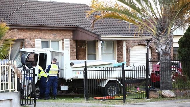 Police at the scene where the truck crashed into a house in Merrylands on Saturday, July 22, 2017.