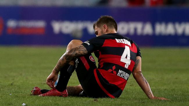 Wanderers’ Joshua Risdon sits on the ground after losing 3-2 and missing the finals.