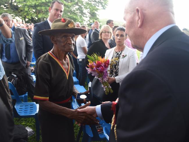 Governor General Peter Cosgrove meets Fuzzy Wuzzy Angel Havala Lavla while laying at wreath at the Anzac Day dawn service at Bomana War Cemetery near Port Moresby, Papua New Guinea. Picture: AAP