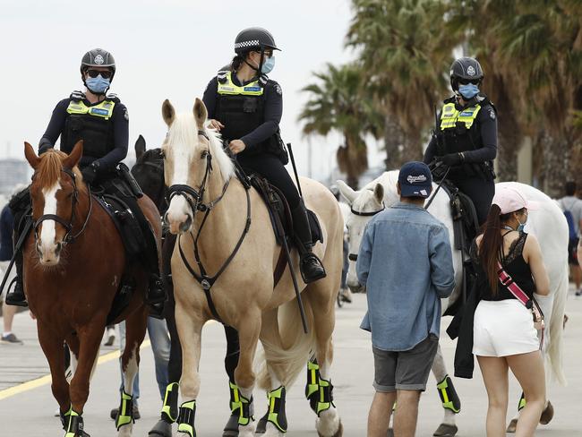 MELBOURNE, AUSTRALIA - NCA NewsWire Photos October 4, 2020:  Police on horses are seen at St Kilda beach in Melbourne, Victoria. Picture: NCA NewsWire / Daniel Pockett