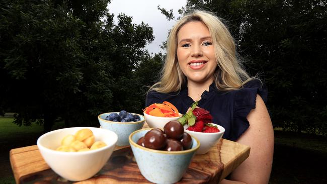 Sophie Steinhardt, the daughter of Kevin and Lisa, checks out some of the tasty treats at the new Macadamias Australia visitor centre in Bundaberg. Picture: Adam Head