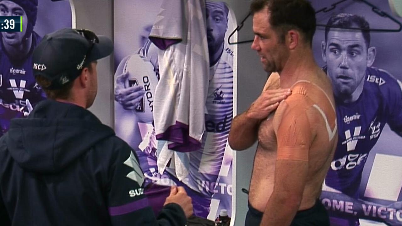 Cameron Smith is attended to by a club doctor in the sheds.