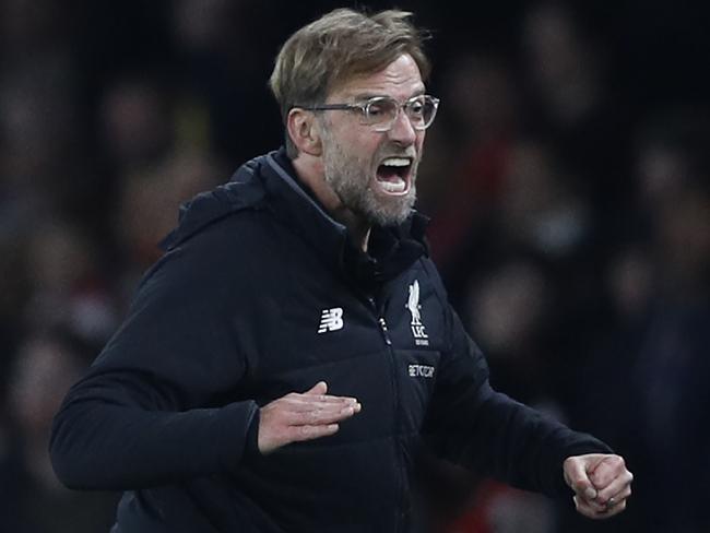 Liverpool's German manager Jurgen Klopp gestures during the English Premier League football match between Arsenal and Liverpool at the Emirates Stadium in London on December 22, 2017.  / AFP PHOTO / Adrian DENNIS / RESTRICTED TO EDITORIAL USE. No use with unauthorized audio, video, data, fixture lists, club/league logos or 'live' services. Online in-match use limited to 75 images, no video emulation. No use in betting, games or single club/league/player publications.  /