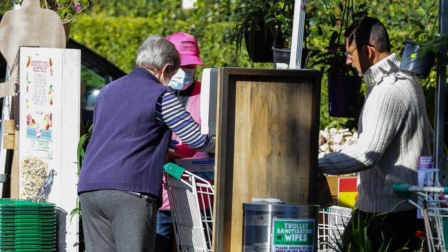 Shoppers are being urged to wear face masks in Sydney hot spots and areas like supermarkets where social distancing is difficult. Photo: Gaye Gerard