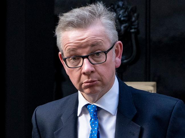 Britain's Environment, Food and Rural Affairs Secretary Michael Gove reacts as he leaves 10 Downing Street in London on March 28, 2019. - The British government said it intended to put Prime Minister Theresa May's twice-rejected Brexit deal to a third parliamentary vote on Friday to avoid a chaotic no-deal divorce from the EU in two weeks. May's throw of the dice comes a day after her dramatic pledge to resign in order to persuade her rivals to finally back her vision for breaking Britain's 46-year bond with the European project. (Photo by Niklas HALLE'N / AFP)