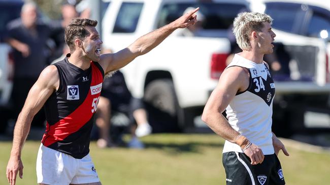 Rance shouts out instructions to his Essendon teammates in the backline. Picture: AFL Photos via Getty Images