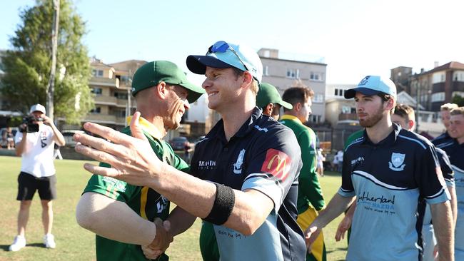 David Warner and Steve Smith embrace at the end of the Sydney Grade Cricket clash. (Photo by Mark Metcalfe/Getty Images)