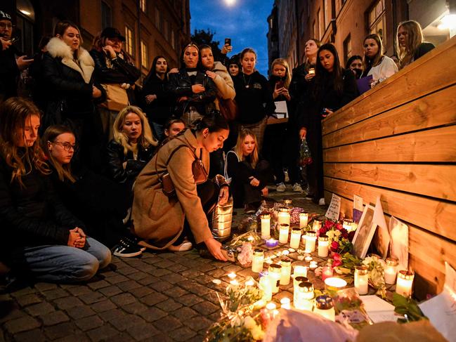 Fans gather for a vigil with flowers and candles to pay tribute to Liam Payne in Stockholm, outside the studio where One Direction recorded albums. Picture: AFP / Sweden OUT