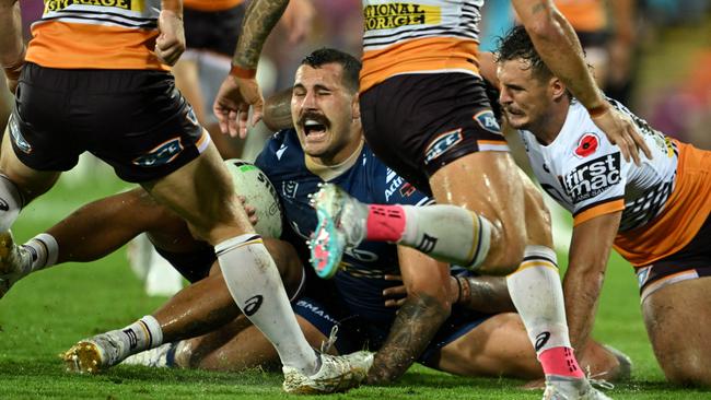 Parramatta’s Reagan Campbell-Gillard winces in pain after Brisbane prop Payne Haas fell on his leg last week. Picture: NRL Photos