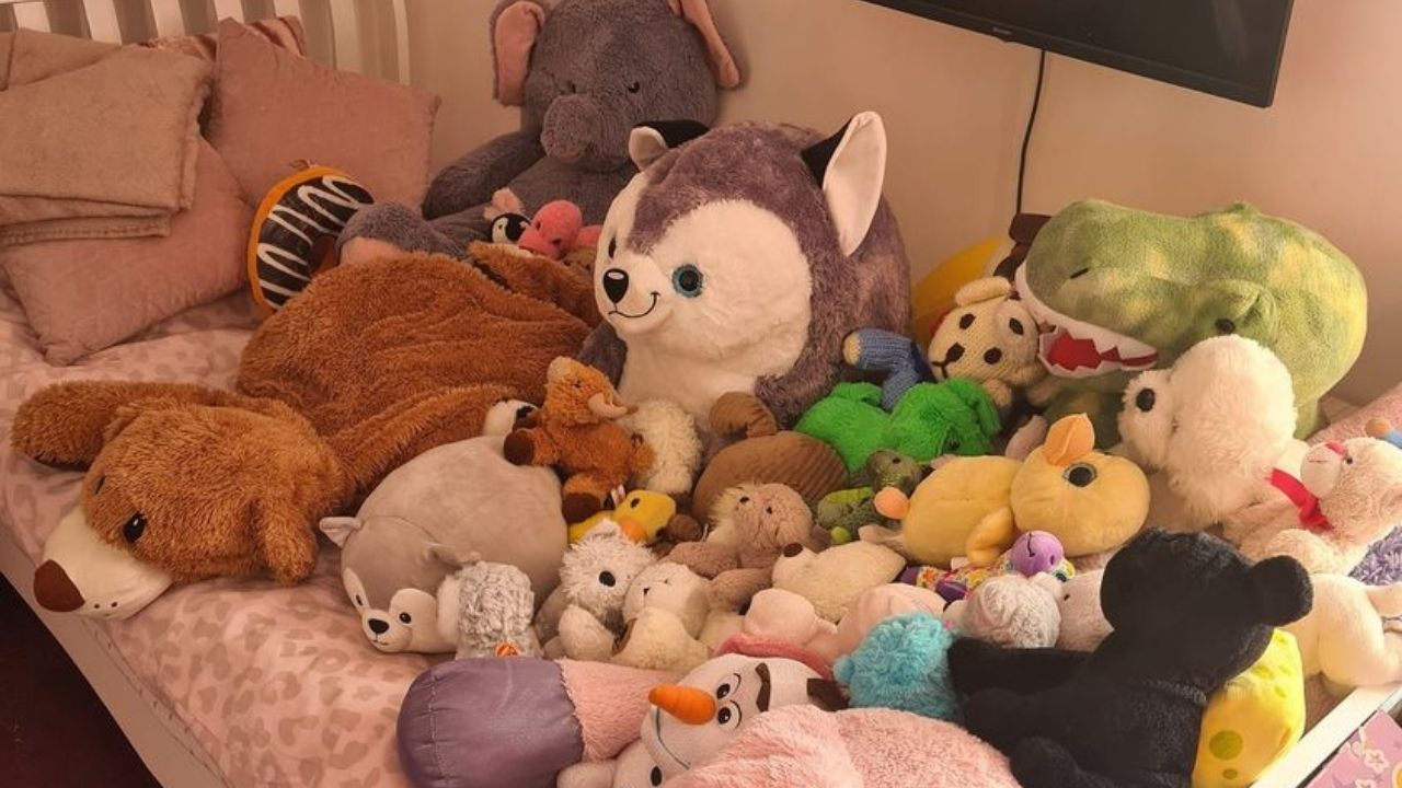 bed full of teddy bears