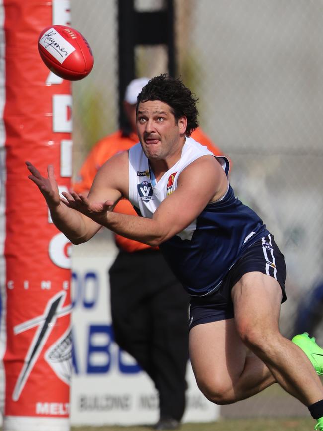 Brendan Fevola marks for Melton South, where he was co-coach. Picture: Alex Coppel.