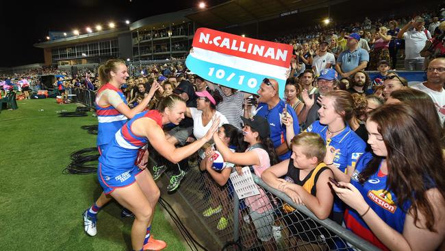 Nicole Callinan and Brooke Lochland sign autographs after the win over Fremantle. Picture: Rob Leeson