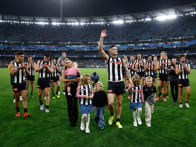 Crisp walks off the MCG with his family. Picture: Michael Willson/AFL Photos