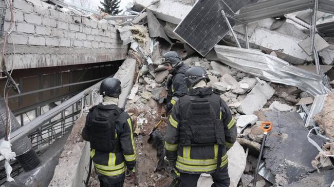 This handout photograph published on December 11, 2024, on the official Telegram channel of the head of the Zaporizhzhia Regional Military Administration Ivan Fedorov, shows rescuers searching for people under the rubble of a medical clinic destroyed by a missile in the city of Zaporizhzhia, amid the Russian invasion of Ukraine. A Russian strike on December 10, 2024, killed eight people and wounded 22 others including a five-year-old girl in the southern Ukrainian city of Zaporizhzhia. (Photo by Handout / Telegram / @ivan_fedorov_zp / AFP) / RESTRICTED TO EDITORIAL USE - MANDATORY CREDIT 