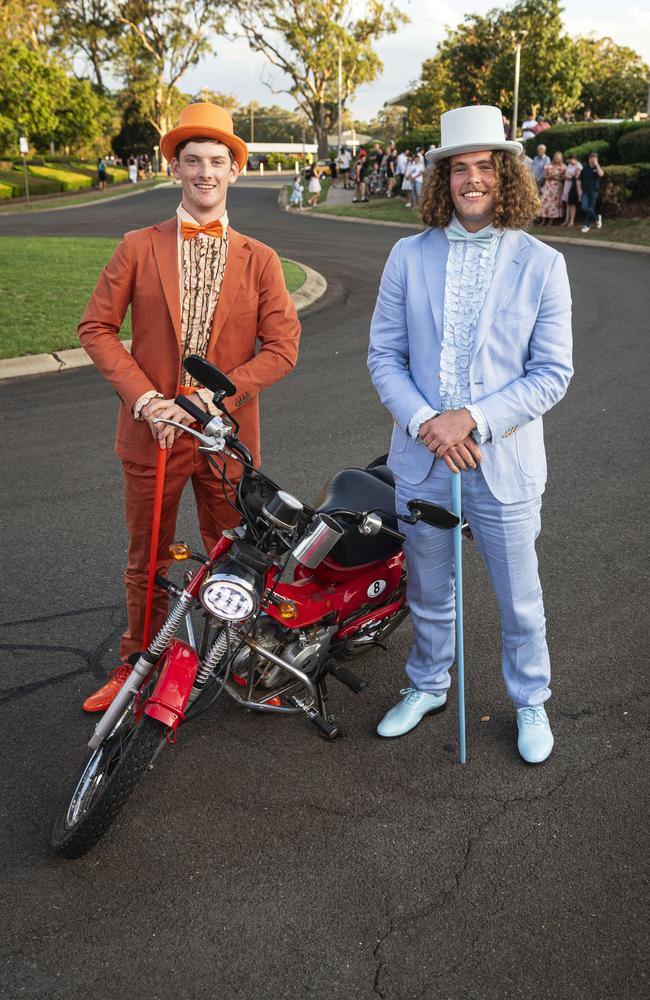 Graduate Daniel Sheath (right) and partner Matthew Thom arrive as Dumb and Dumber characters on a postie bike at Mary MacKillop Catholic College formal at Highfields Cultural Centre, Thursday, November 14, 2024. Picture: Kevin Farmer