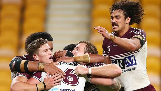 BRISBANE, AUSTRALIA - AUGUST 20: Curtis Sironen of the Sea Eagles celebrates scoring a try with team mates during the round 23 NRL match between the Canberra Raiders and the Manly Sea Eagles at Suncorp Stadium, on August 20, 2021, in Brisbane, Australia. (Photo by Chris Hyde/Getty Images)