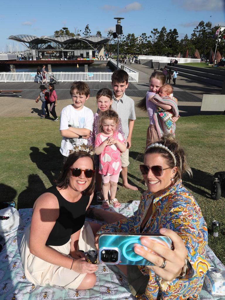 Laura and Sammy Edwards with Chaz, Sadie, Lucy, Goldie, Fletcher and Flora. Locals and visitors arrived early to get a good spot for the Geelong New Years Eve celebrations. Picture: Alan Barber