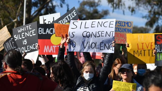 Black Lives Matter protesters in front of Parliament House in Canberra, Friday, June 5, 2020. The protesters were demonstrating aboriginal deaths in custody and the death of George Floyd in the United States. (AAP Image/Mick Tsikas) ING