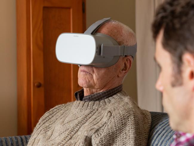 “Everyone should see this so they know” ... Death Railway veteran Jim Kerr watches the Anzac360 virtual reality film, at his home in Melbourne. Picture: Maxim Drygin.