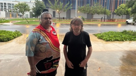 Junella Scott and Paul Holden with Nightclff police station in the background.