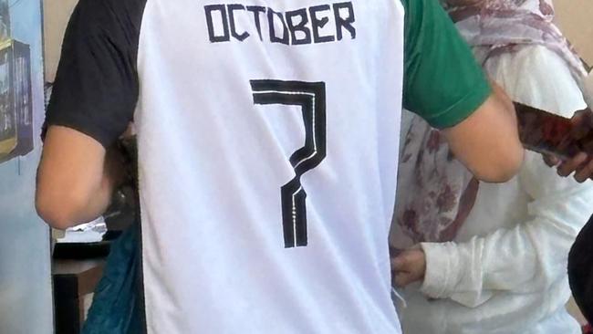 Seen at Scenic World in the Blue Mountains, what appears to be a homemade football jersey – with the colours of the Palestinian flag, a watermelon and the words "October 7".