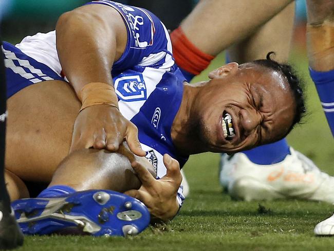 Sauaso Sue of the Bulldogs in pain with an injured knee during the Round 17 NRL match between the Newcastle Knights and the Canterbury Bulldogs at McDonald Jones Stadium in Newcastle, Friday, July 12, 2019.  (AAP Image/Darren Pateman) NO ARCHIVING, EDITORIAL USE ONLY