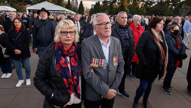 A couple commemorating Anzac Day at Melbourne’s Dawn Service. Picture: NCA NewsWire/David Geraghty