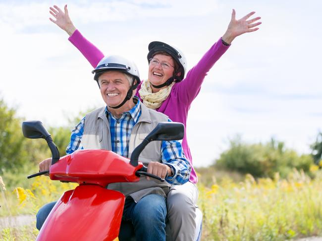 Happy senior couple on motor scooter. For Herald Sun Realestate retirement story 24MAR18. iStock image.